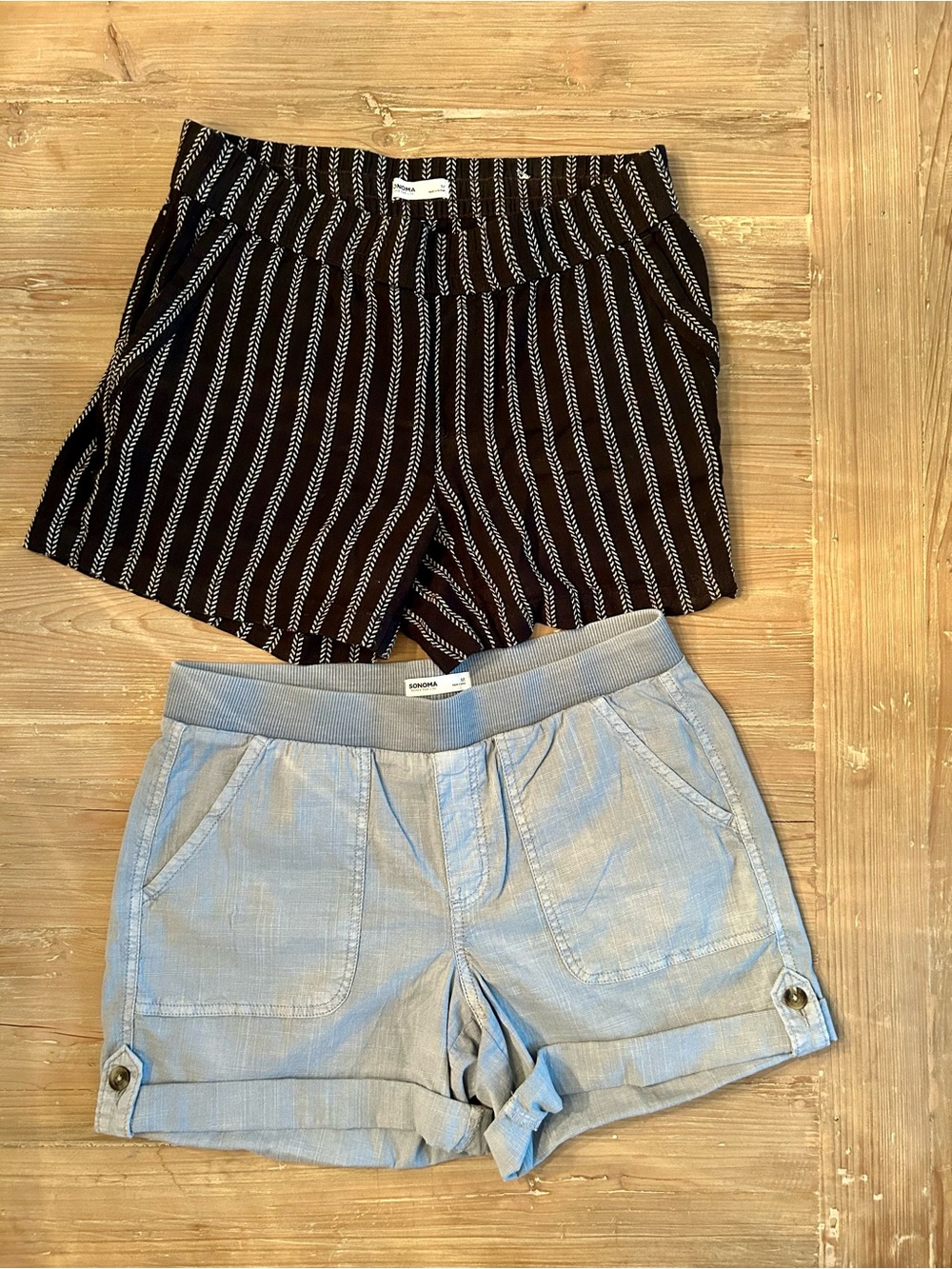 2 pair of women’s pull on shorts with front and back pockets.